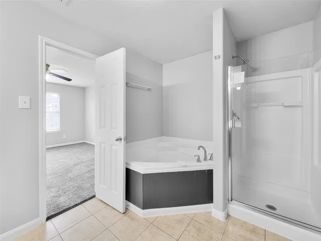 a bathroom with a shower and a sink