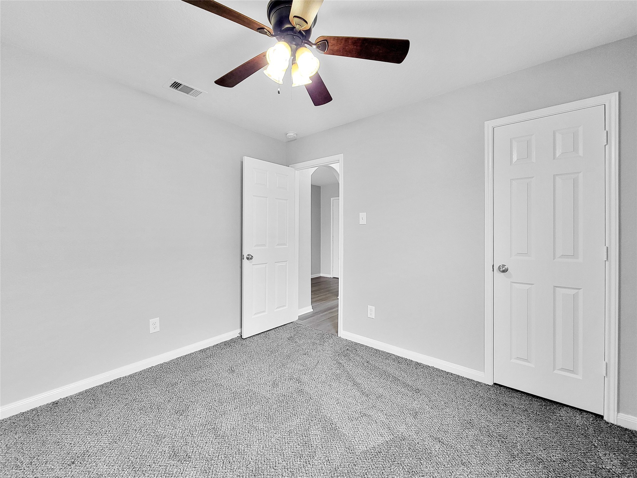 930 Paradise Road Baytown, TX 77521 - Photo 9 of 18 an empty room with chandelier fan