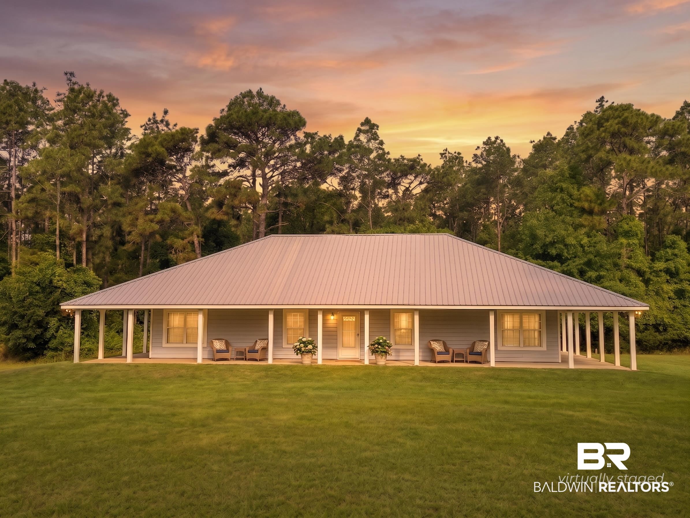 20219 Greek Cemetery Road Robertsdale, AL 36567 - Photo 1 of 41 Ranch-style residence featuring a full-length covered porch, light blue siding, and a metal roof