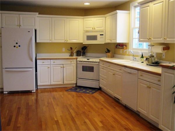 52 Manor Avenue Wellesley, MA 02482 - Photo 4 of 6 a kitchen with a refrigerator sink and cabinets