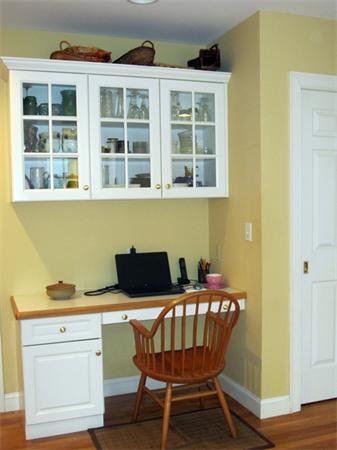 52 Manor Avenue Wellesley, MA 02482 - Photo 5 of 6 a blue table and chair in a room next to a window