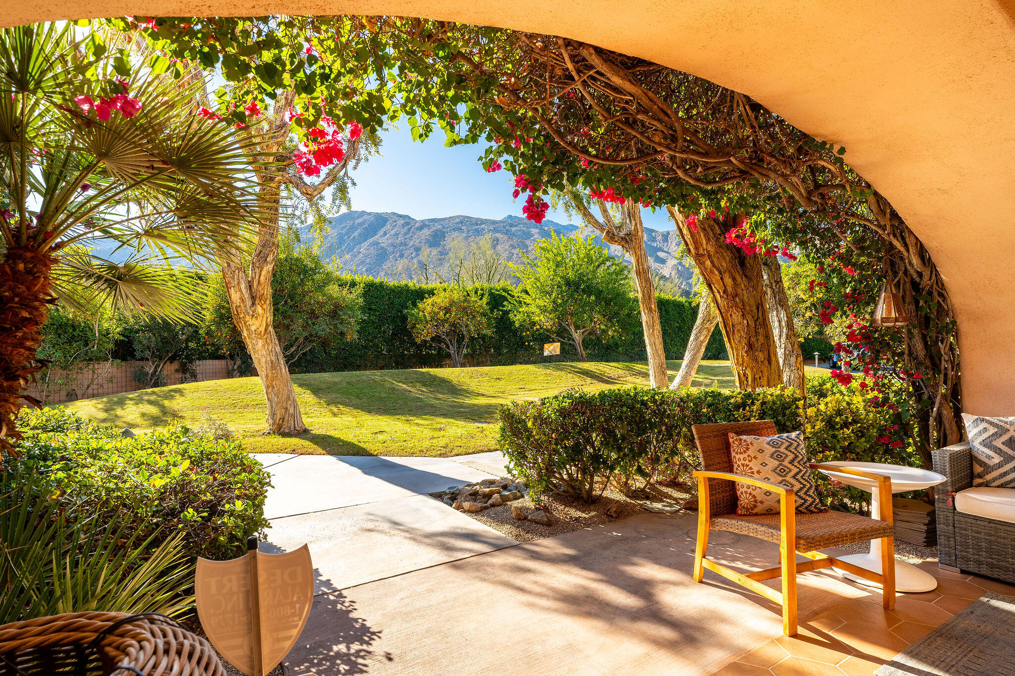 500 East Amado Road, Unit 106 Palm Springs, CA 92262 - Photo 1 of 30 a view of backyard with swimming pool and seating space