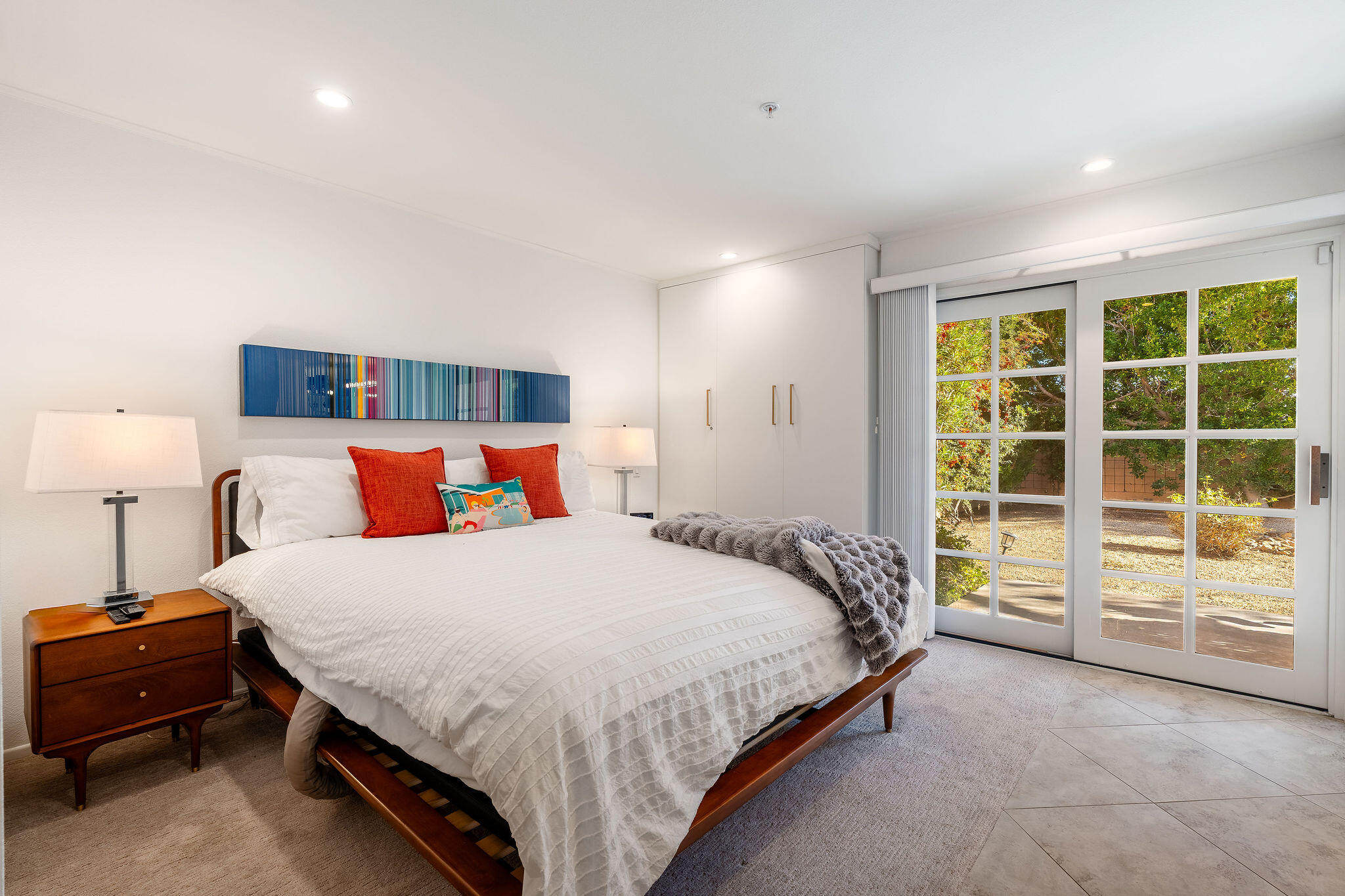 500 East Amado Road, Unit 106 Palm Springs, CA 92262 - Photo 11 of 30 a bedroom with a large bed and a large window