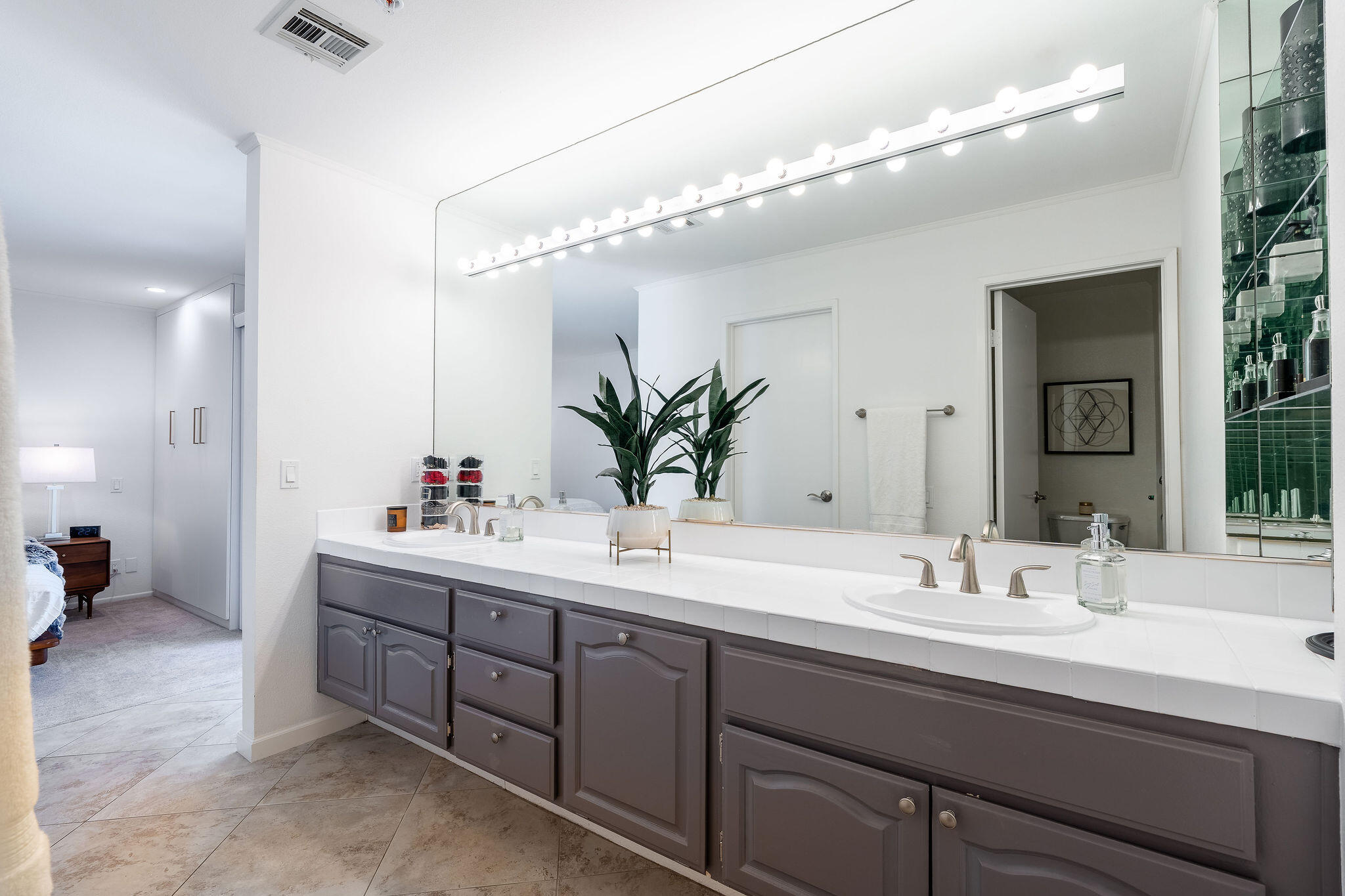 500 East Amado Road, Unit 106 Palm Springs, CA 92262 - Photo 13 of 30 a bathroom with a double vanity sink mirror and