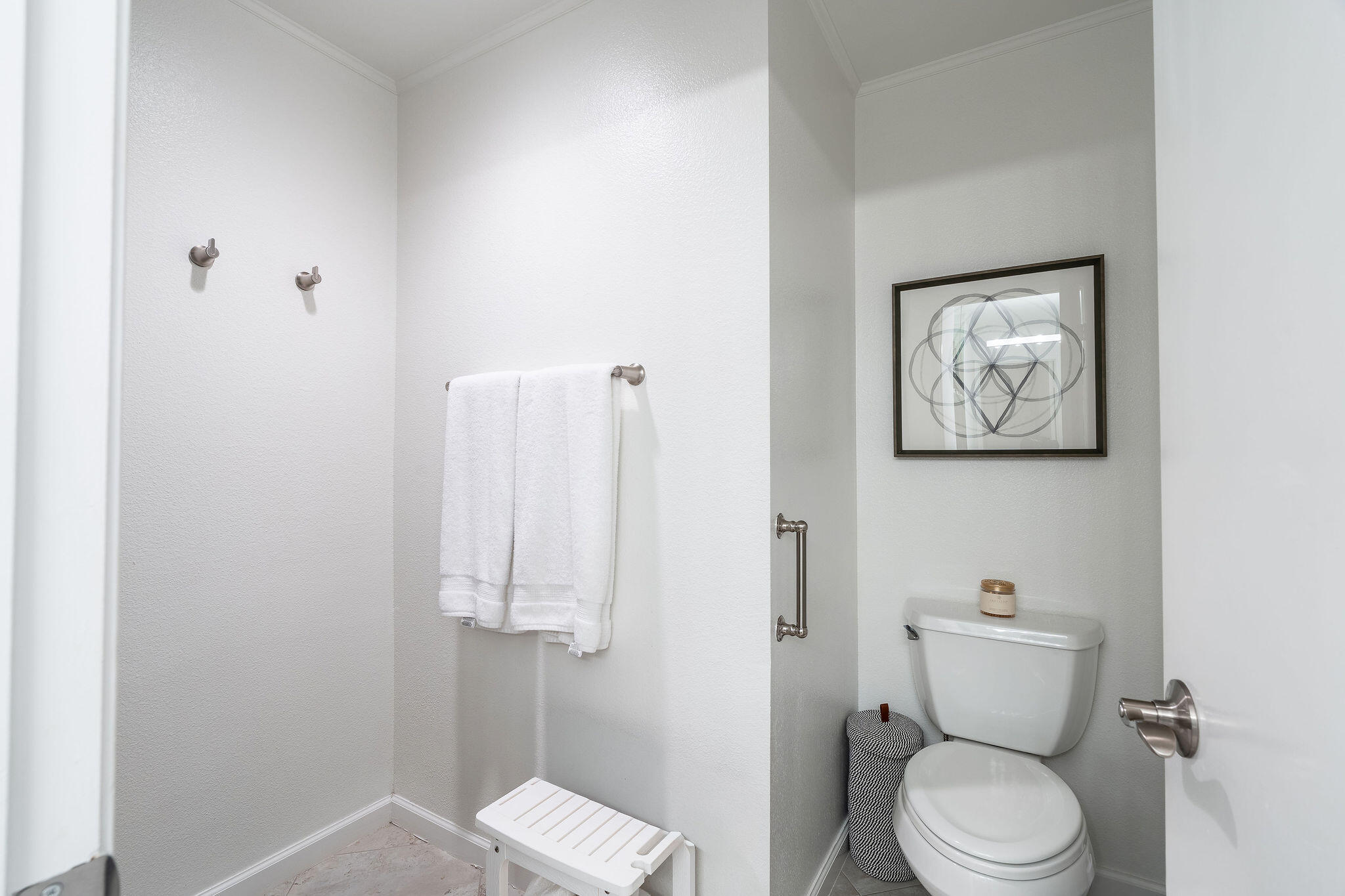 500 East Amado Road, Unit 106 Palm Springs, CA 92262 - Photo 14 of 30 a white toilet sitting next to a bathroom sink