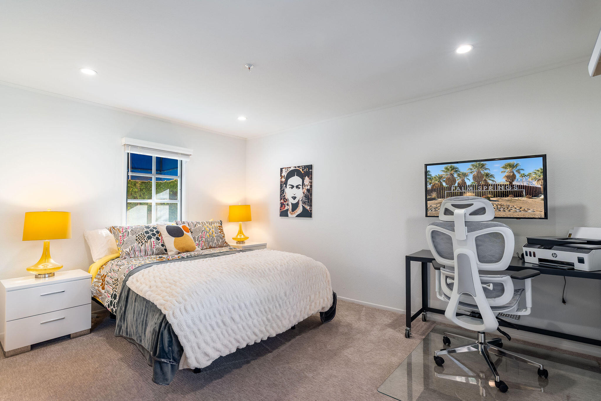 500 East Amado Road, Unit 106 Palm Springs, CA 92262 - Photo 15 of 30 a bedroom with a bed and a window