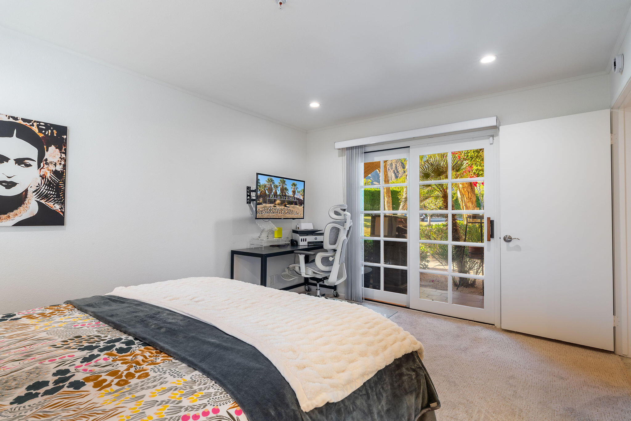 500 East Amado Road, Unit 106 Palm Springs, CA 92262 - Photo 16 of 30 a bedroom with a bed and a window
