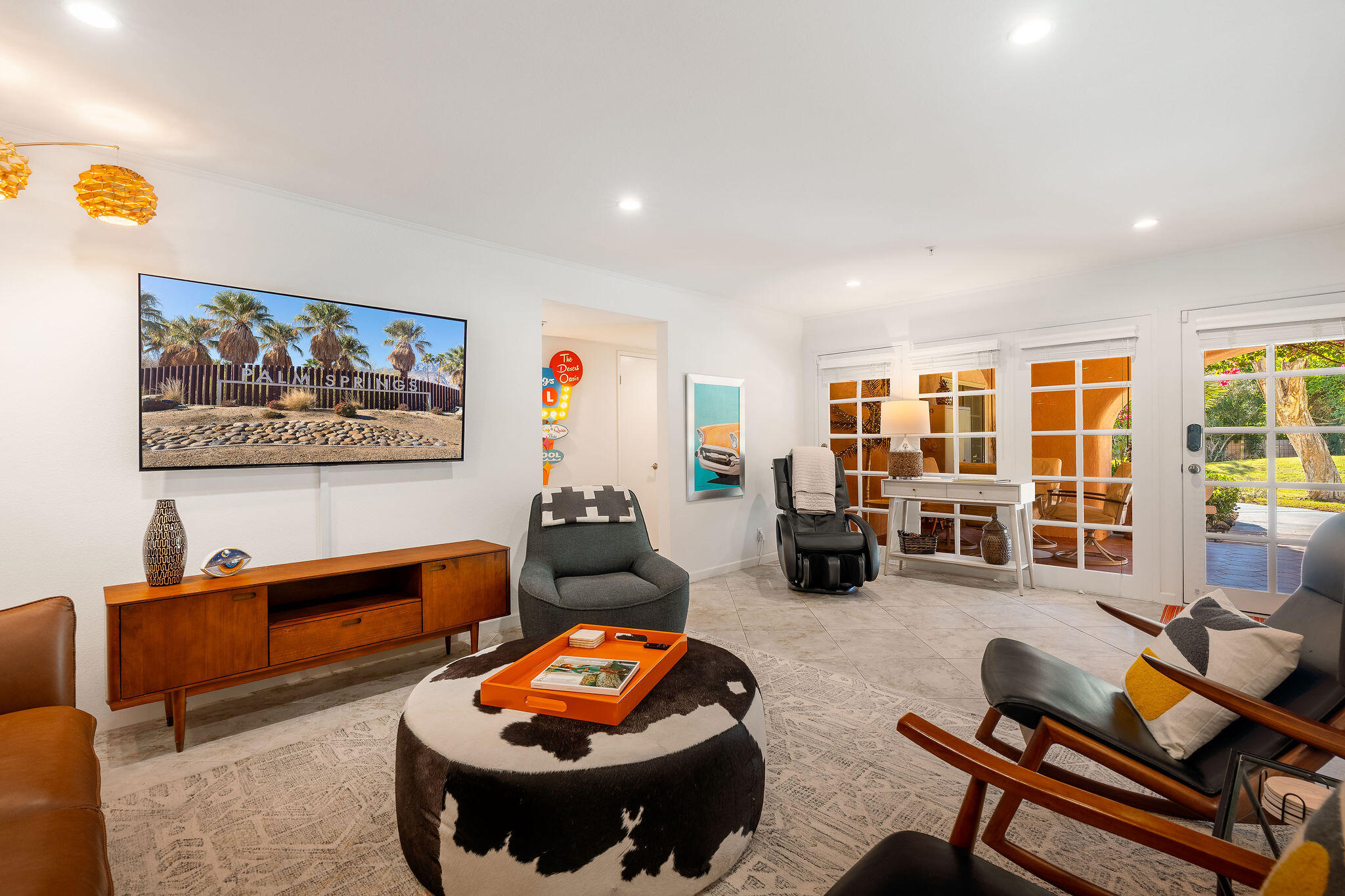 500 East Amado Road, Unit 106 Palm Springs, CA 92262 - Photo 2 of 30 a living room with furniture a rug and a large window