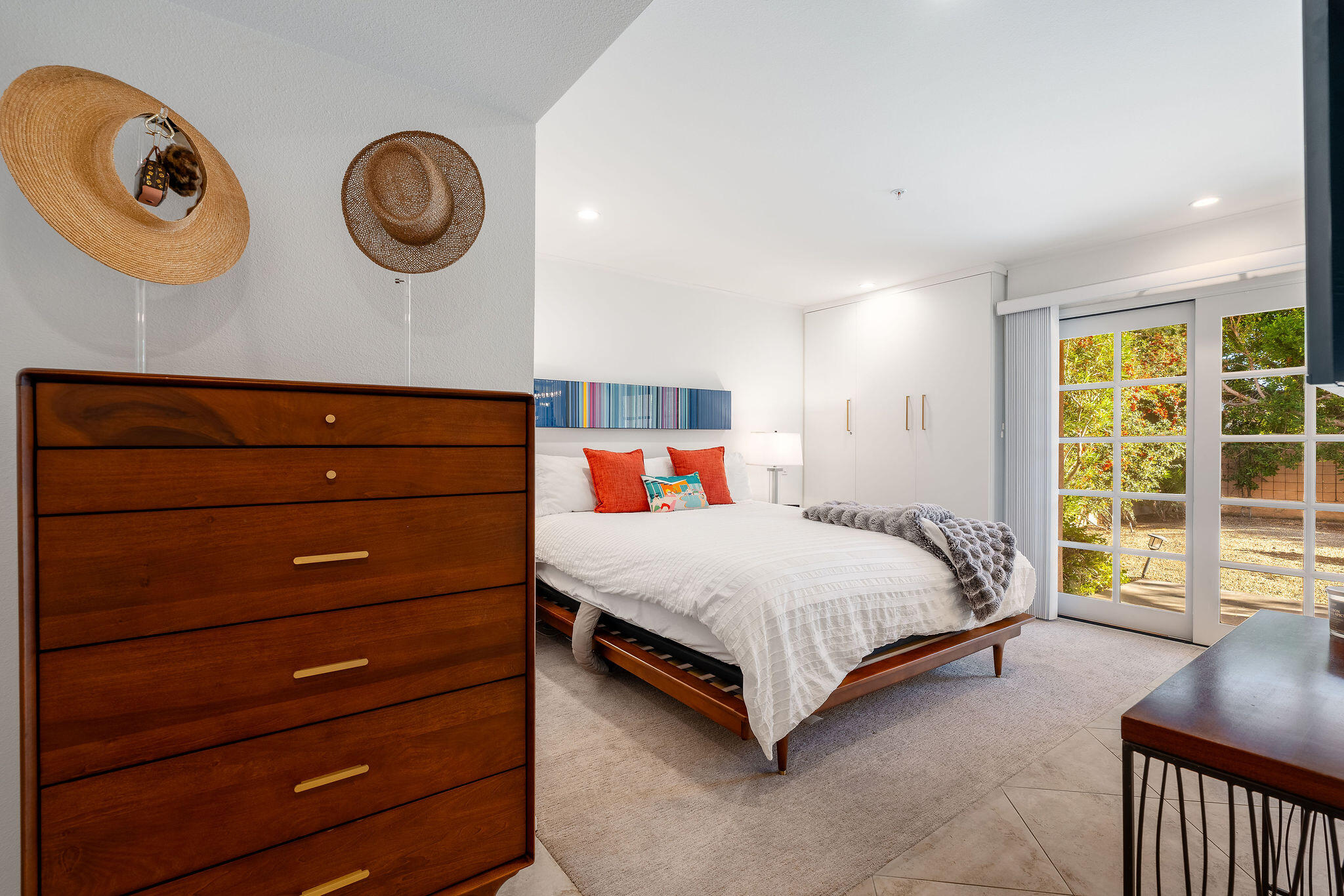 500 East Amado Road, Unit 106 Palm Springs, CA 92262 - Photo 10 of 30 a bedroom with a bed and a large window