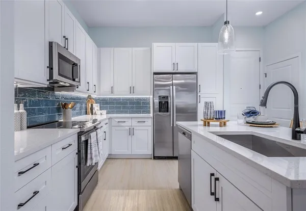a living room with furniture and a lamp