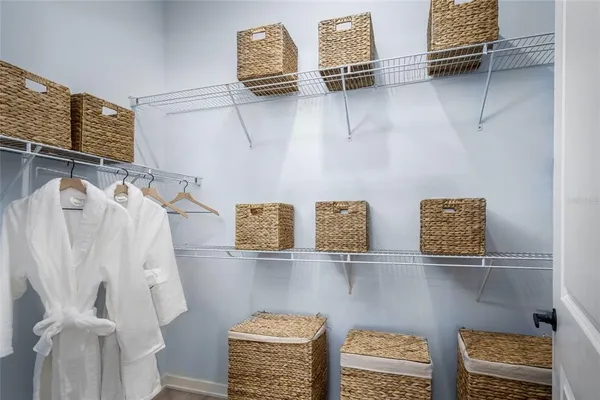 a bed room with a bed and a lamp