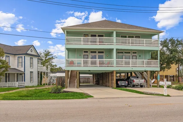 a front view of a house with a yard and table and chairs