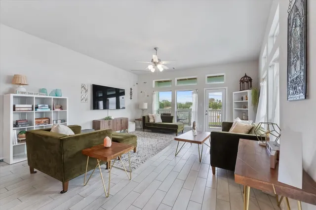 a living room with fireplace furniture and a flat screen tv