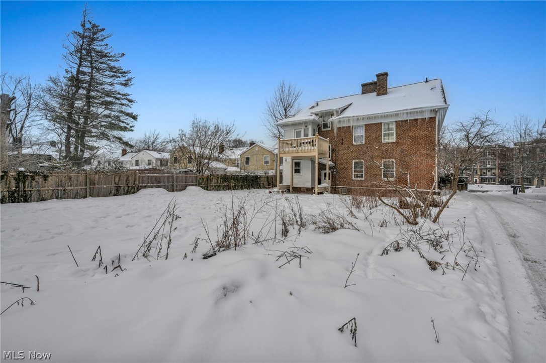 2410 Overlook Road Cleveland Heights, OH 44106 - Photo 48 of 50 Snow covered house with a chimney, a balcony, and brick siding