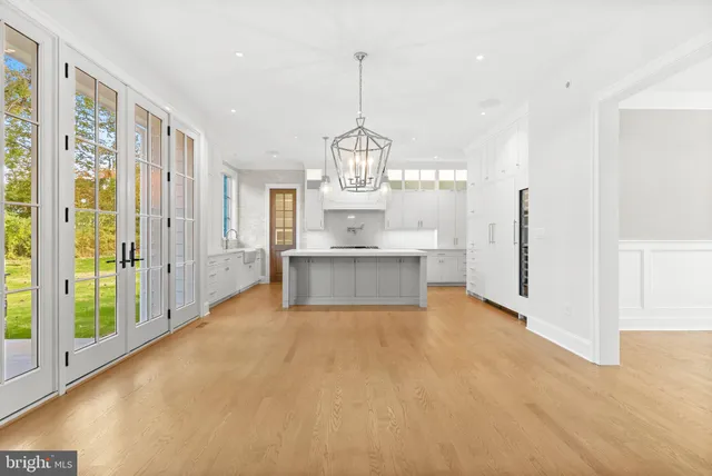 a view of a room with window and a ceiling fan