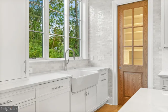 a bathroom with a sink a vanity and a mirror