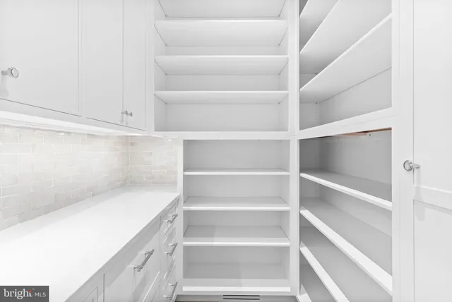 a utility room with sink dryer and washer