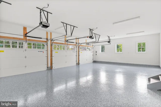 a bathroom with a granite countertop toilet sink and mirror