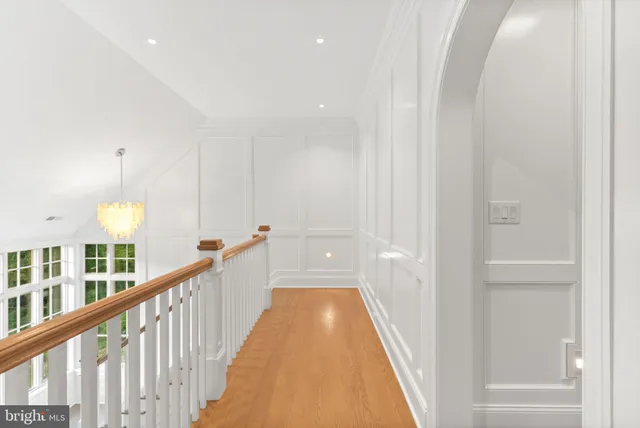 a kitchen with granite countertop a sink and dishwasher a stove top oven with wooden floor