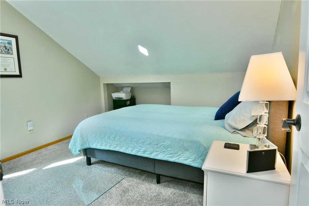 13491 Woodin Road Chardon, OH 44024 - Photo 28 of 35 Carpeted bedroom featuring lofted ceiling