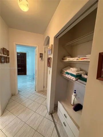 a bedroom with bed and window