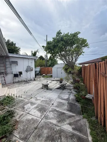 a view of a backyard of the house