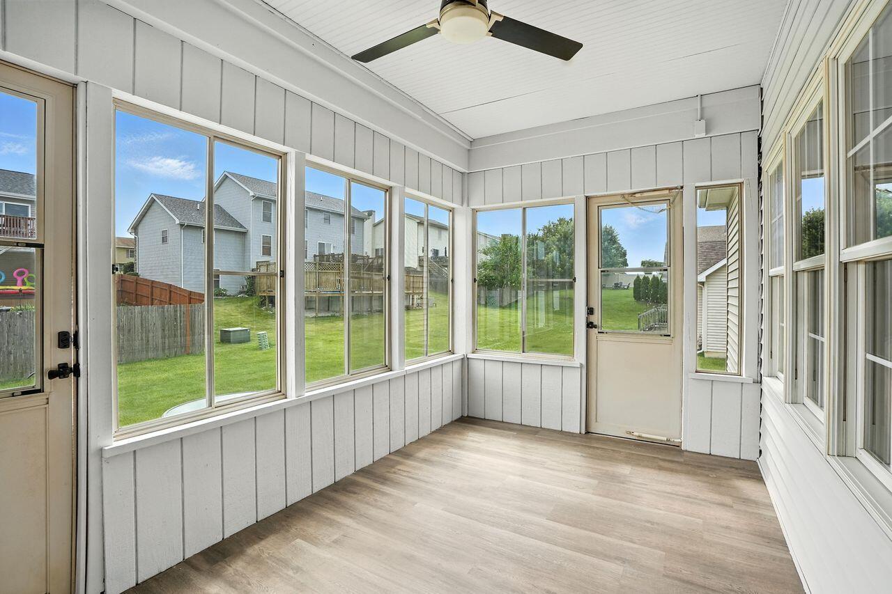 183 West 126th Place Crown Point, IN 46307 - Photo 24 of 25 a view of an empty room with wooden floor and a window