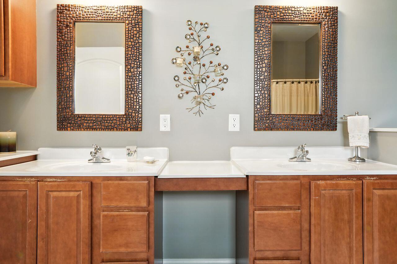 183 West 126th Place Crown Point, IN 46307 - Photo 5 of 25 a bathroom with a granite countertop sink and a mirror