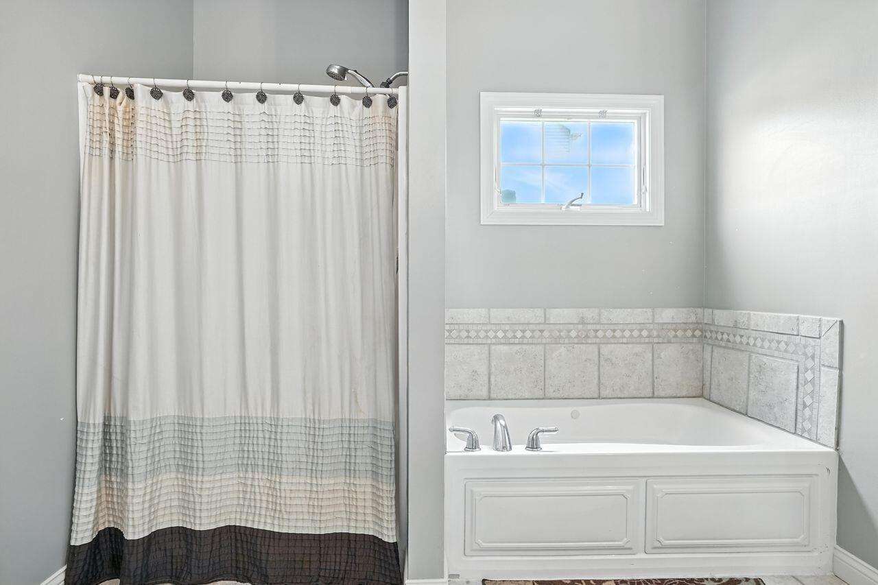 183 West 126th Place Crown Point, IN 46307 - Photo 8 of 25 a bathroom with a bathtub and shower