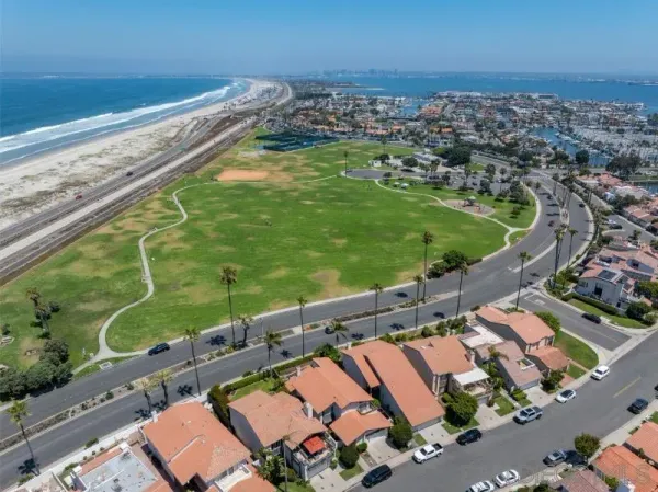 an aerial view of a house with a lake view