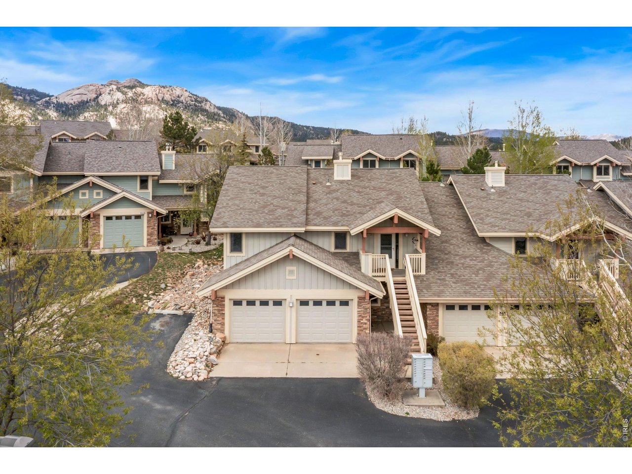 a view of a big house with a big yard