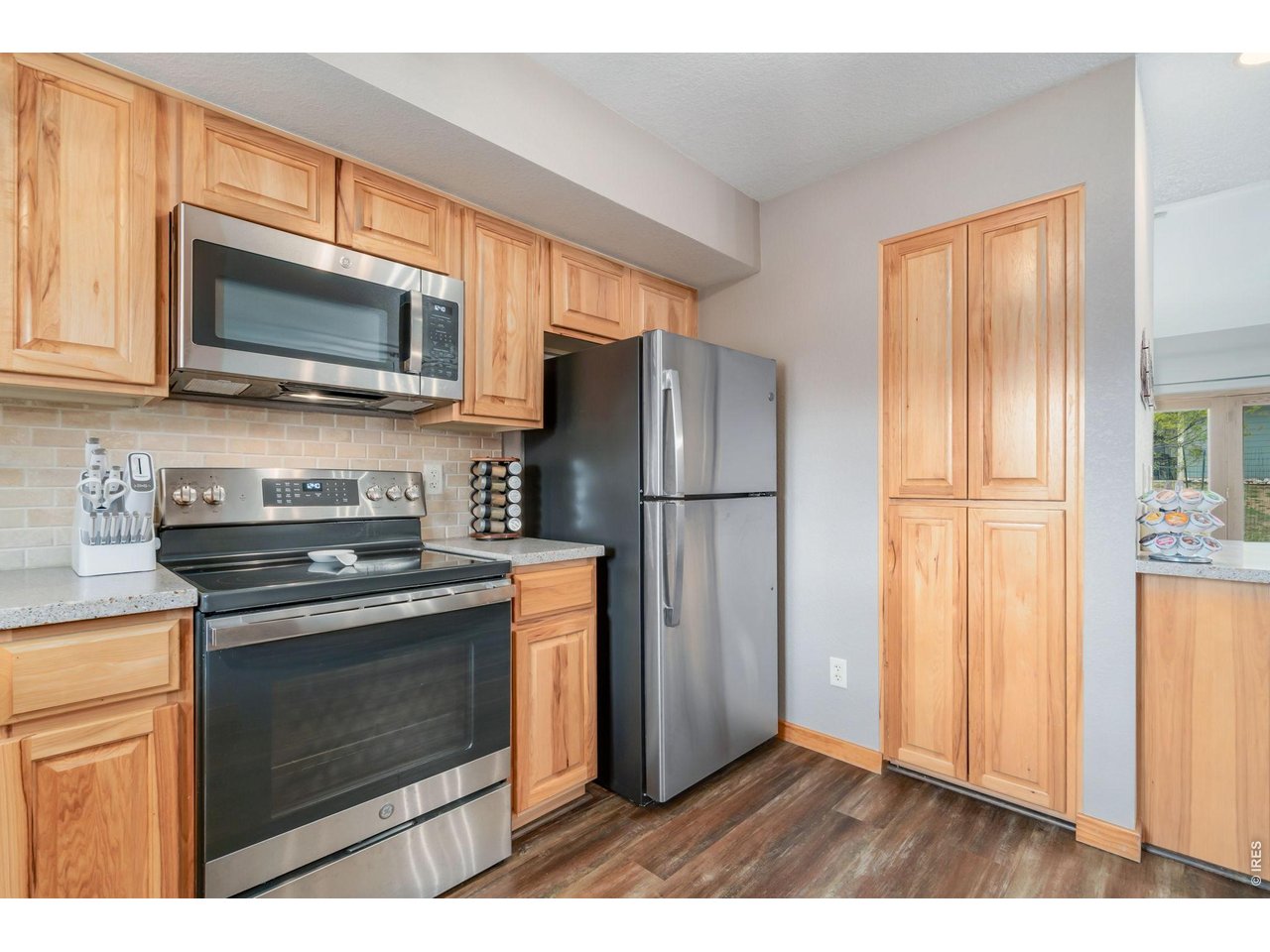 1761 Wildfire Road Estes Park, CO 80517 - Photo 13 of 45 a kitchen with stainless steel appliances granite countertop a refrigerator microwave and sink