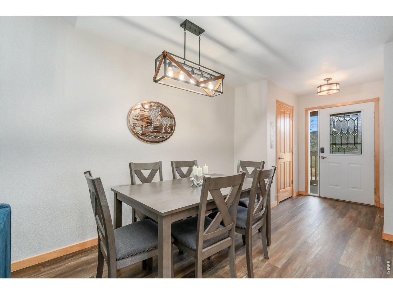 1761 Wildfire Road Estes Park, CO 80517 - Photo 15 of 45 a view of a dining room with furniture and wooden floor