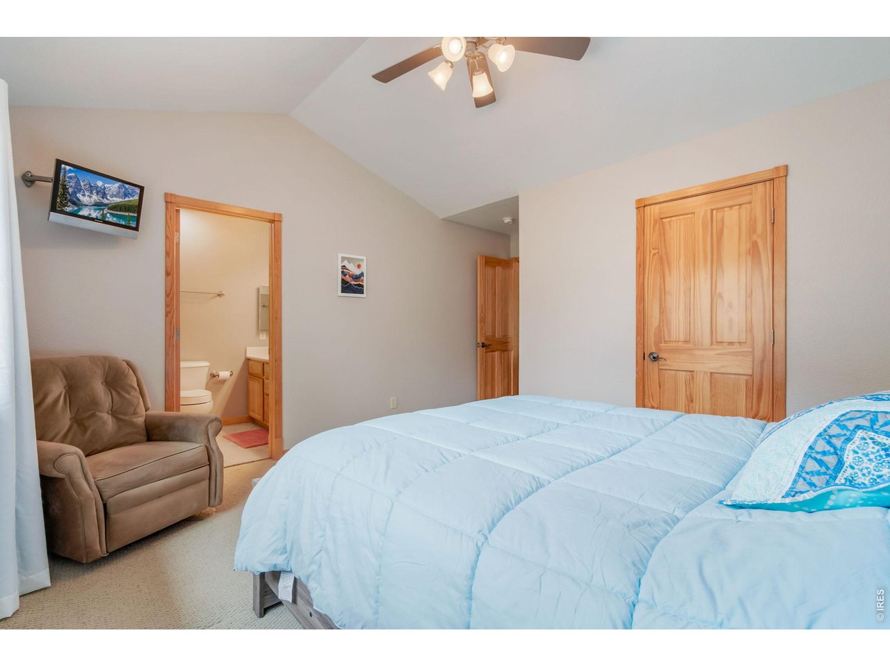 1761 Wildfire Road Estes Park, CO 80517 - Photo 21 of 45 a bedroom with a bed couch and a window