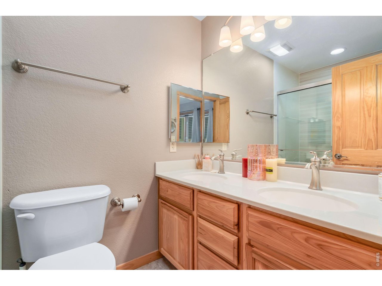 1761 Wildfire Road Estes Park, CO 80517 - Photo 22 of 45 a bathroom with a toilet sink and mirror