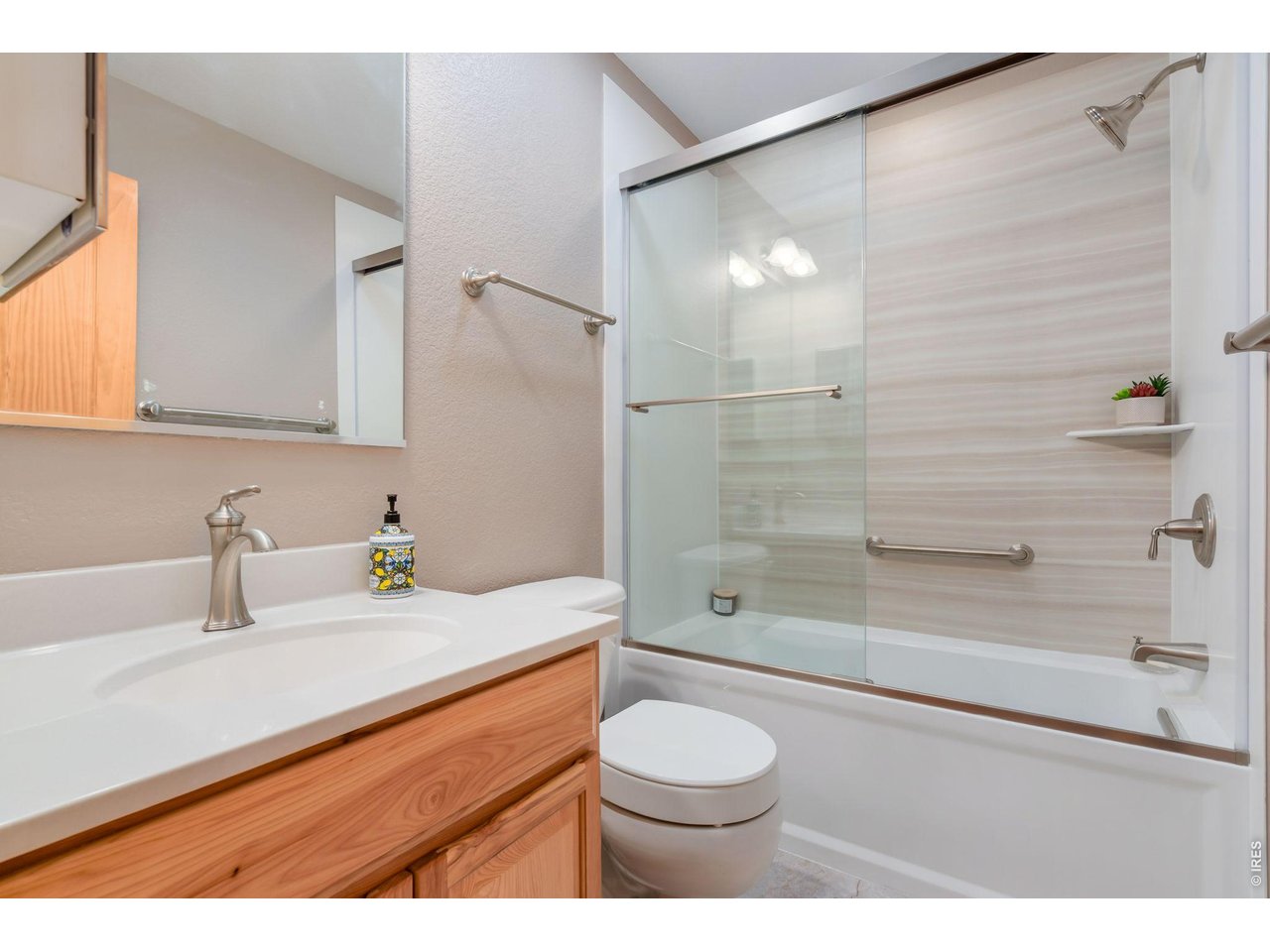1761 Wildfire Road Estes Park, CO 80517 - Photo 25 of 45 a bathroom with a sink a toilet and shower