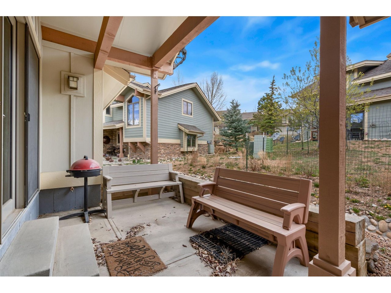 1761 Wildfire Road Estes Park, CO 80517 - Photo 31 of 45 a view of a terrace with furniture and a potted plant