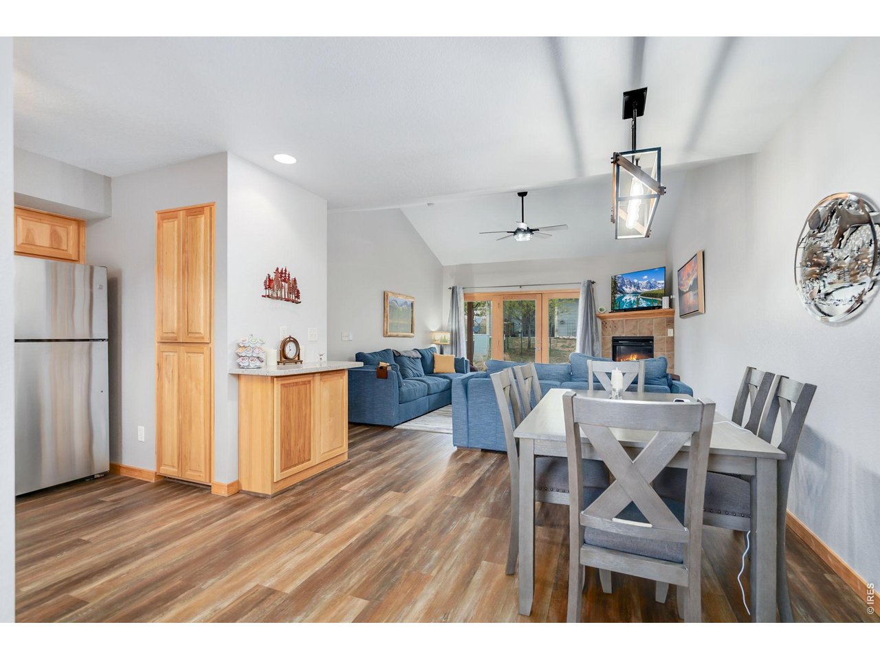 1761 Wildfire Road Estes Park, CO 80517 - Photo 6 of 45 a view of a dining room with furniture a kitchen and chandelier
