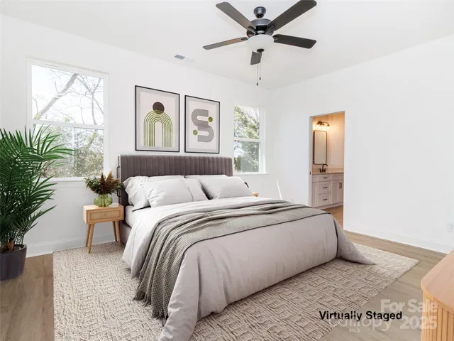 a bedroom with a large bed and a window