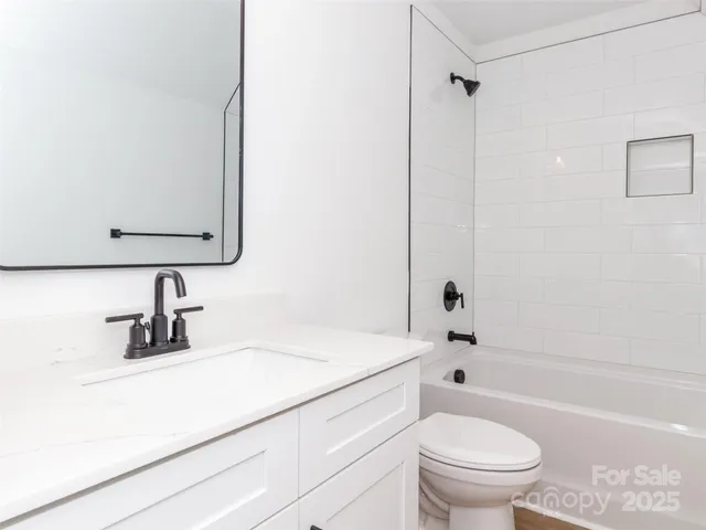 a bathroom with a sink a toilet and a bathtub
