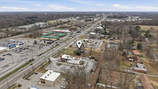 a front view of a house with yard