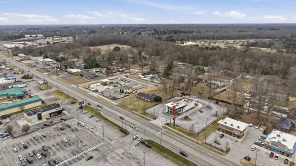 a front view of a house with yard