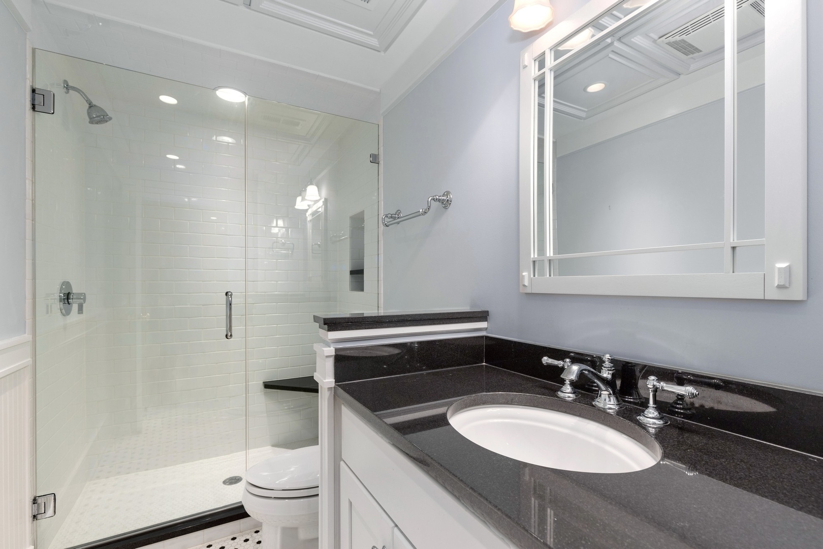 240 Deerfield Road Deerfield, IL 60015 - Photo 24 of 37 a bathroom with a sink a toilet a mirror and shower