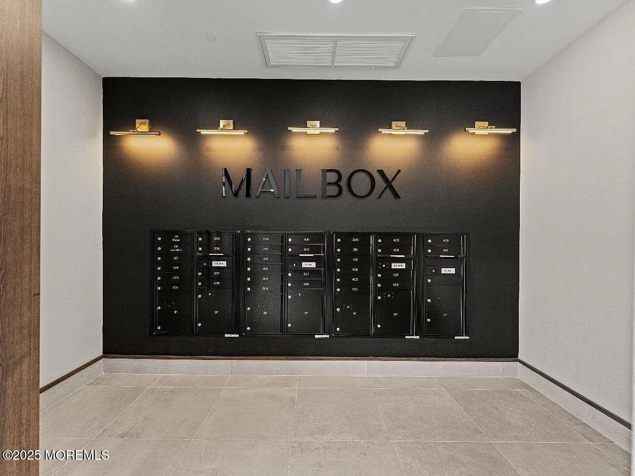 27 3rd Avenue, Unit 210 Long Branch, NJ 07740 - Photo 4 of 28 a view of a projector room with a projector room