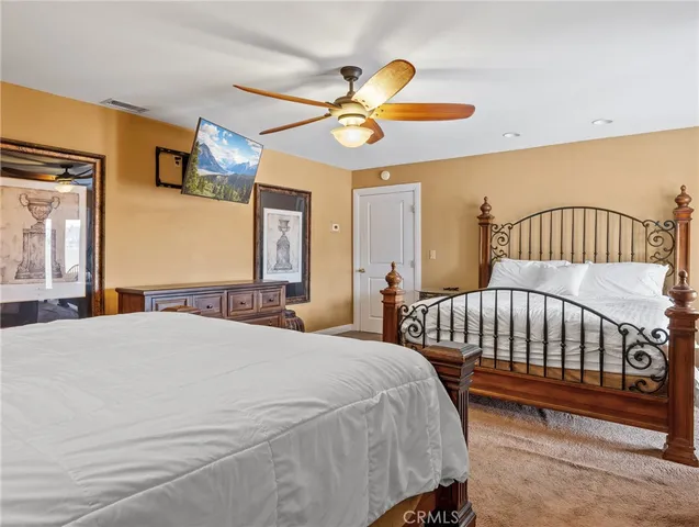 a bathroom with a sink toilet and a mirror