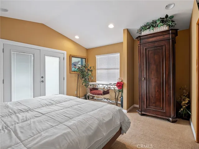 a bedroom with a bed and a cabinets