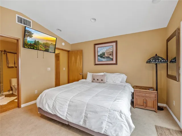 a bathroom with a toilet a sink and a shower