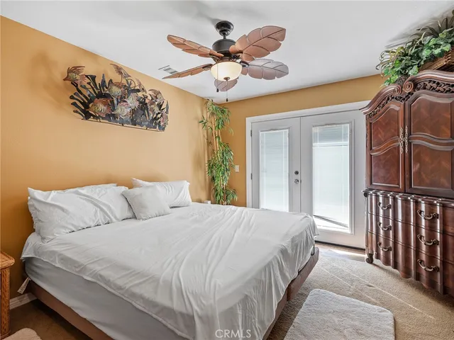 a bedroom with a bed and cabinets