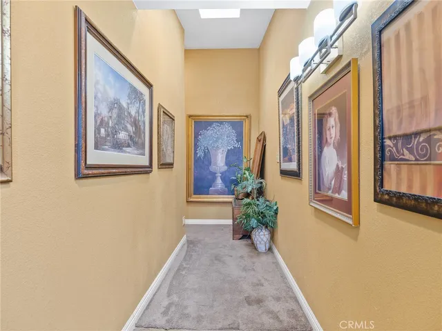 a backyard of a house with wooden floor and outdoor seating