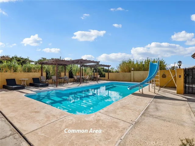 a view of a house with swimming pool